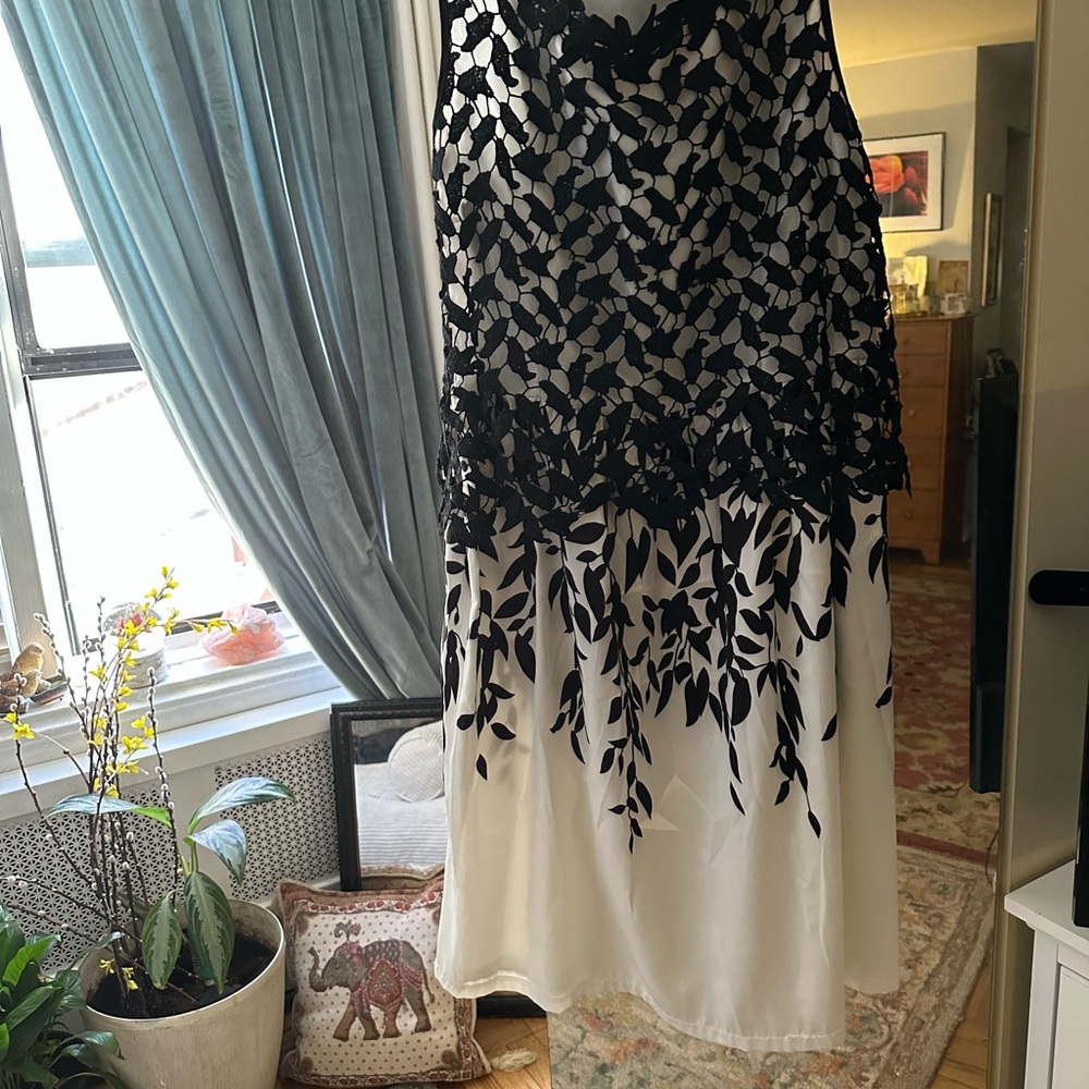 Evening cocktail dress knee length, size 10-12. Beautifully detailed and laced.